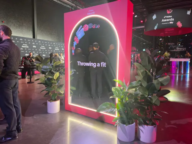 A mirror with throwing a fit written on it.