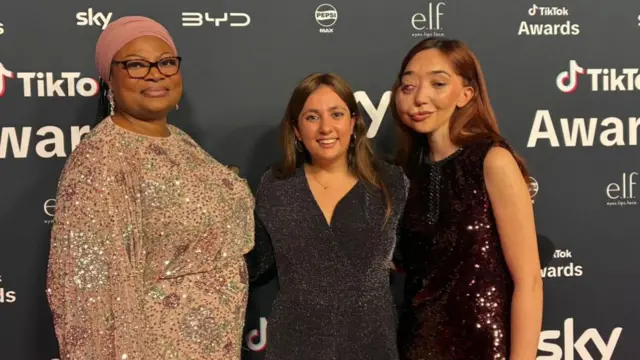 Bus Aunty, Yasmin and Nikki Lilly pose for the camera with their arms around one another