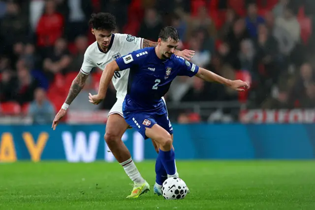 Nico O'Reilly of England and Ognjen Mimovic of Serbia challenge