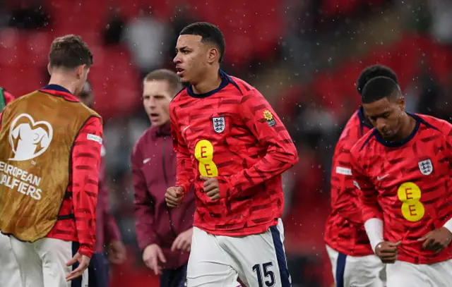 Morgan Rogers of England warms up