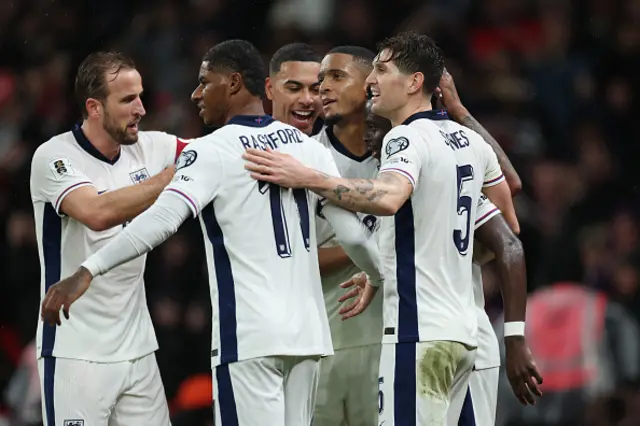 Bukayo Saka of England celebrates with teammates Harry Kane, Morgan Rogers, Marcus Rashford, Ezri Konsa and John Stones