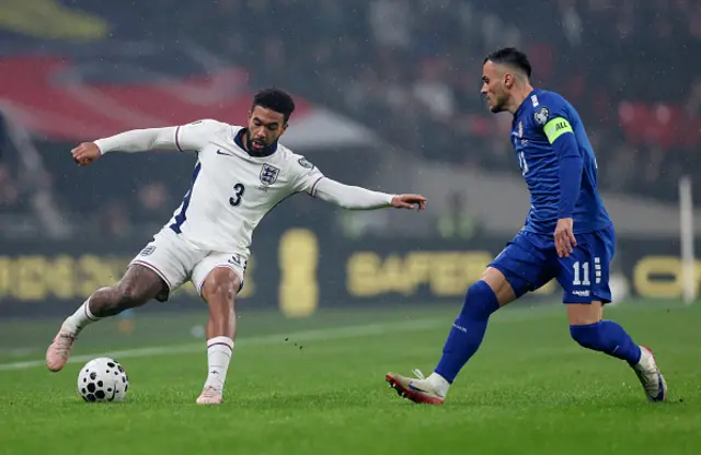 Reece James of England controls the ball whilst under pressure from Filip Kostic