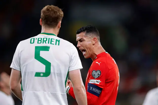 Cristiano Ronaldo celebrates in front of Jake O'Brien