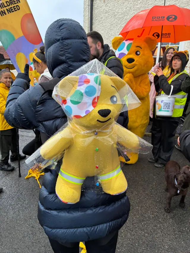 Pudsey backpack covered in raincoat