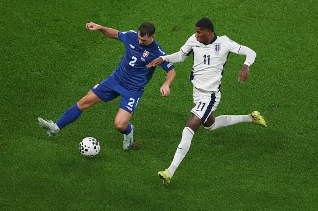 Marcus Rashford of England is challenged by Ognjen Mimovic