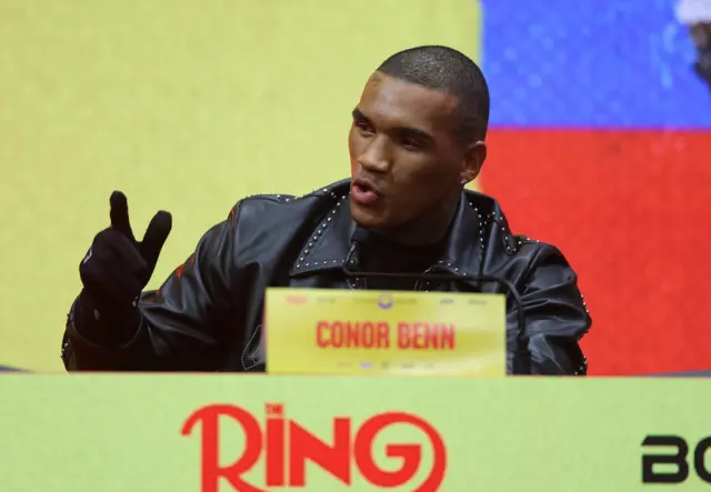 Conor Benn holds up his hand as he speaks