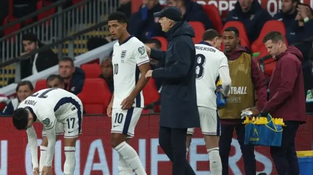 Thomas Tuchel manager of England speaks to Jude Bellingham