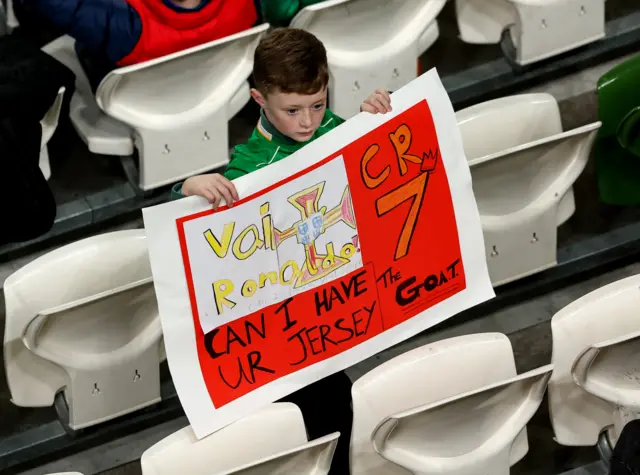 A young Republic of Ireland fan asks for Cristiano Ronaldo's jersey