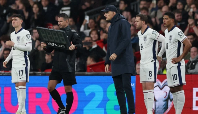 England's Phil Foden, Jordan Henderson and Jude Bellingham get ready to come on as substitutes