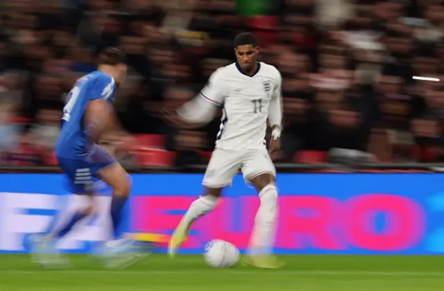 Marcus Rashford of England runs with the ball