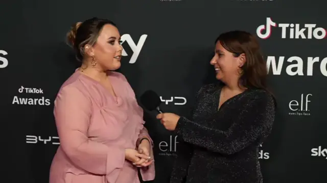 Charley Marlowe being interviewed by Yasmin Rufo on the TikTok red carpet