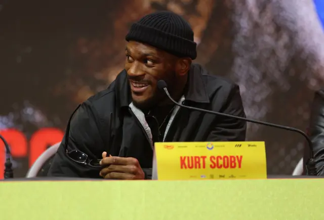 Kurt Scoby laughs as he tales off his sunglasses