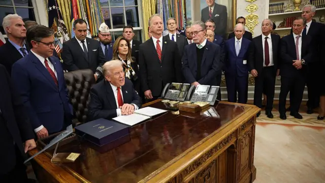 Trump speaks int he Oval Office while surrounded by Republicans
