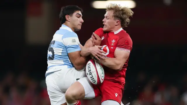Blair Murray loses out in the air for Wales against Argentina