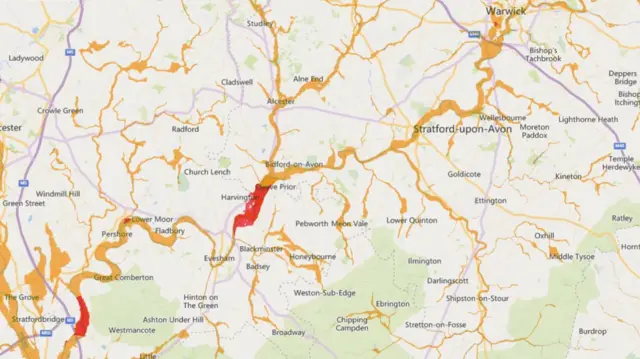 A map with a long orange streak across the middle with a couple of red patches