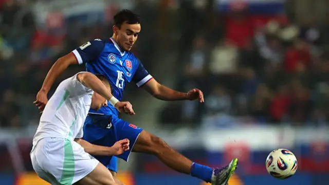 Dan Ballard battles for possession