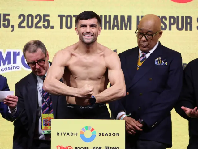 Jack Catterall flexes as he weighs in