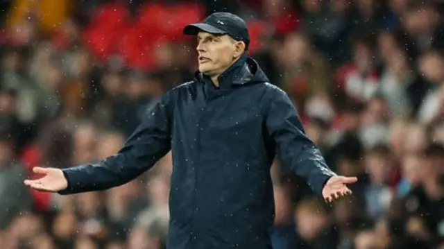 Thomas Tuchel gestures with his arms during England's match against Serbia.