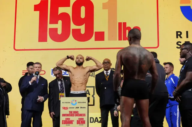 Conor Benn watches on as Chris Eubank Jr weighs in