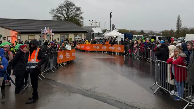 Groups of people in rain coats