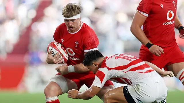 Aaron Wainwright carries the ball for Wales against Japan in Kobe