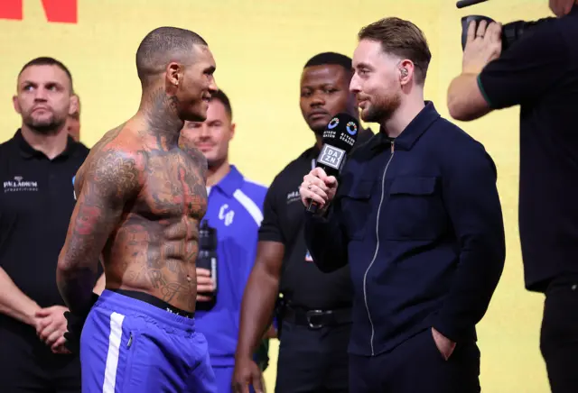 Conor Benn speaks at a weigh-in