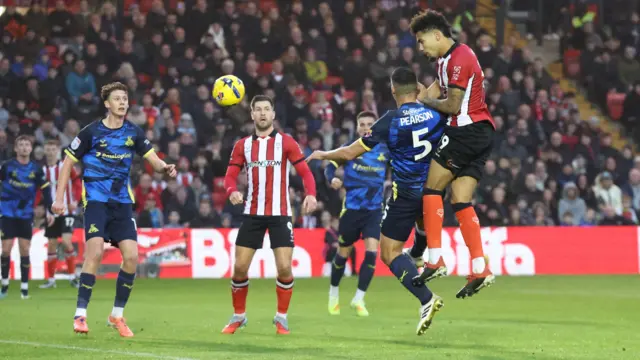 Frankie Okoronkwo heads Lincoln into the lead against Doncaster