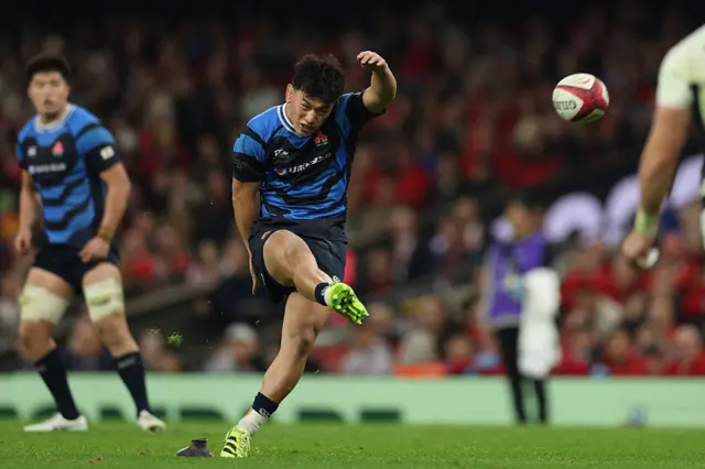 Lee Seung-Sin kicks a penalty