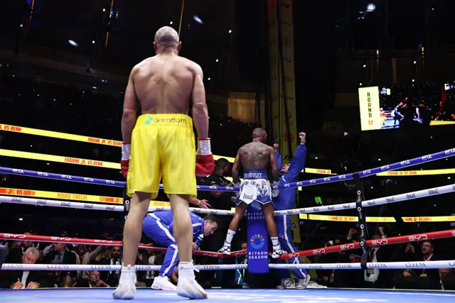 Chris Eubank Jr looks on as Conor Benn celebrates