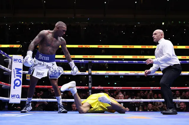 Conor Benn looks at Chris Eubank Jr on the canvas