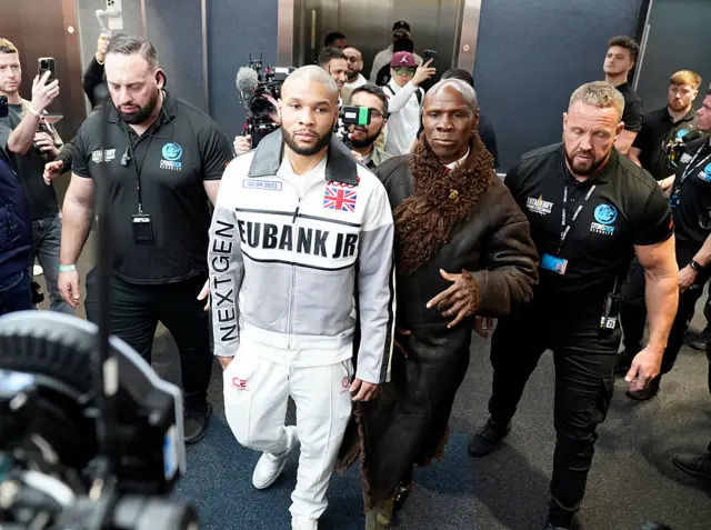 Chris Eubank Jr and Sr stepping out the lift at Tottenham Hotspur Stadium