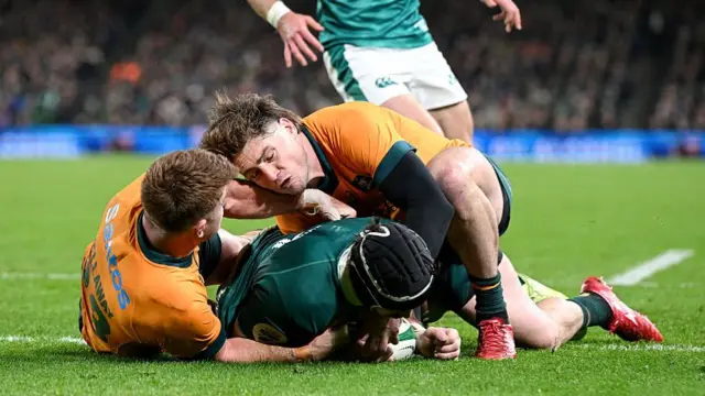 Caelan Doris scores a try for Ireland