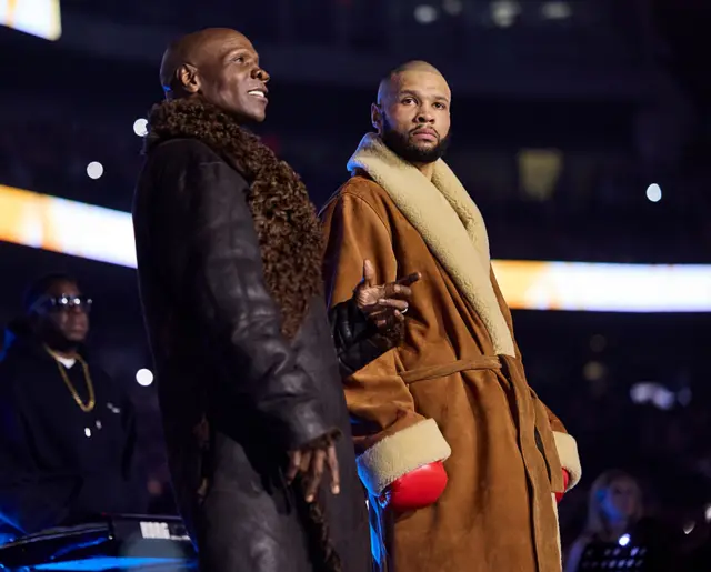 Chris Eubank Sr and Jr standing next to each other