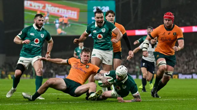 Mack Hansen scores his third try for Ireland against Australia