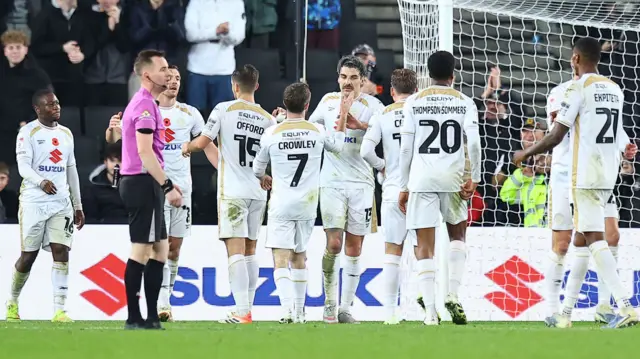 MK Dons players celebrate
