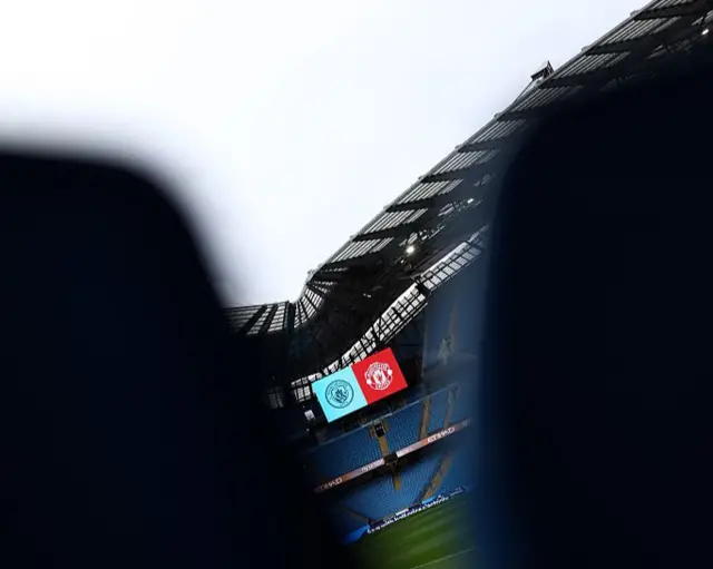 Scoreboard through seats at the Etihad stadium