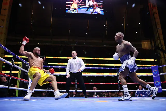 Eubank is knocked down by Benn