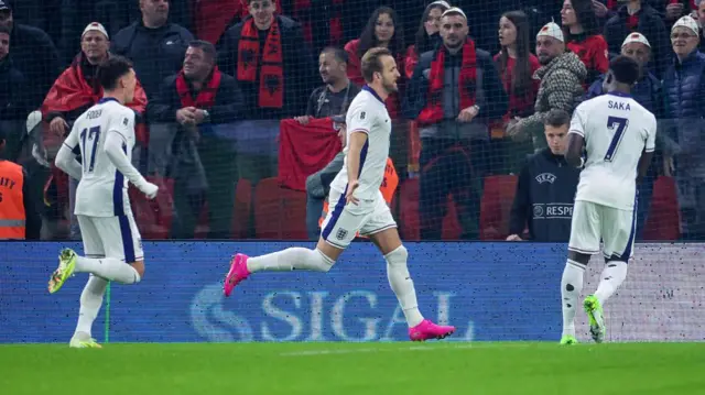 Harry Kane celebrates in front of Albania fans after scoring for England.