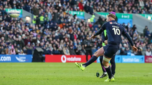 Finn Russell kicks a conversion for Scotland against Argentina