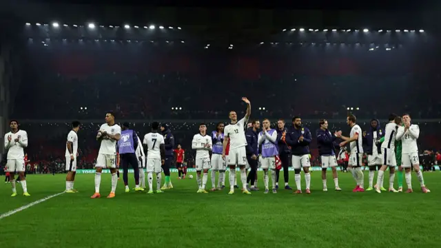 England players applaud the travelling England fans after full-time in Albania.