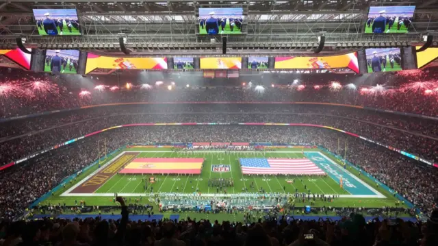 General view of the Bernabeu Stadium before the Washington Commanders play the Miami Dolphins, with Spanish and American flags on the field