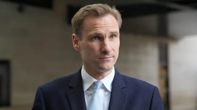 Shadow home secretary Chris Philp in a suit.