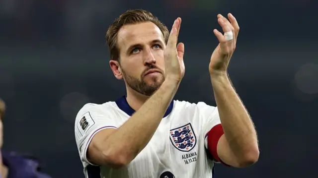 Harry Kane applauds England fans