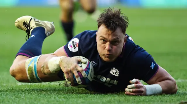 Jack Dempsey scores a try for Scotland against Argentina