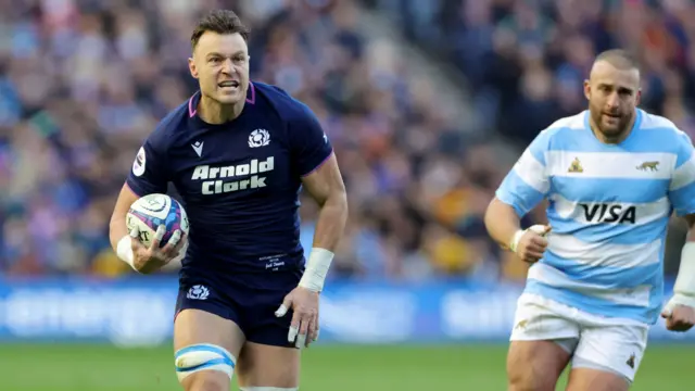 Jack Dempsey scores a try for Scotland against Argentina