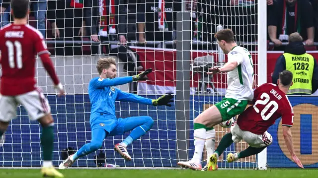 Republic of Ireland goalkeeper Caoimhin Kelleher makes a save from Roland Sallai