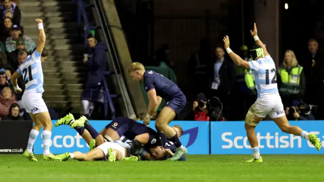 Rodrigo Isgro scores a try for Argentina against Scotland