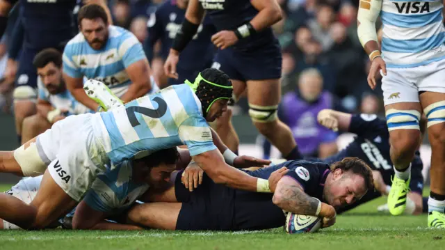 Ewan Ashman scores a try for Scotland against Argentina