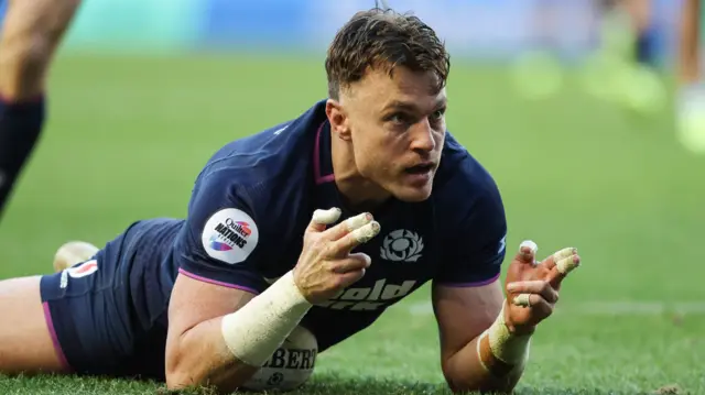 Jack Dempsey celebrates after scoring a try for Scotland against Argentina