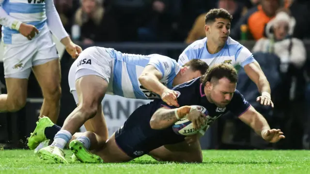 Ewan Ashman scores a try for Scotland against Argentina